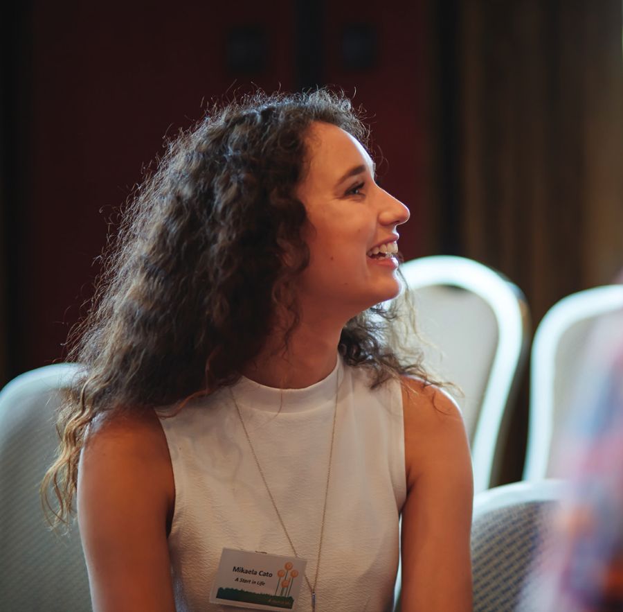 Mikaela smiling at an event